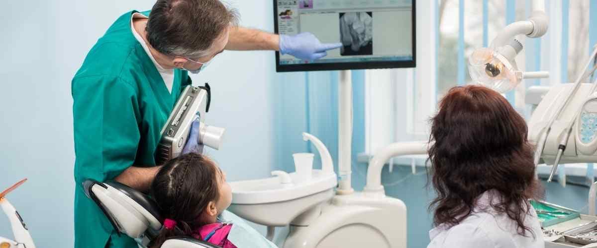 Patient learning about tooth decay causes, symptoms, and treatment options at Bamboo Dental in Richmond Hill